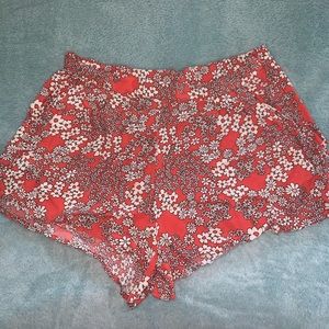 super cute dark orange/red and white floral shorts